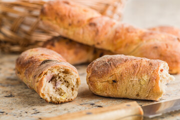 Crusty rustic baguette on kitchen table.