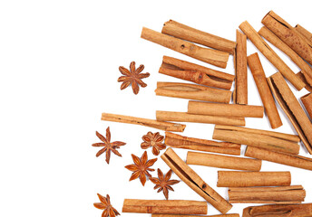 Cinnamon sticks and star anise seeds isolated on white background, top view