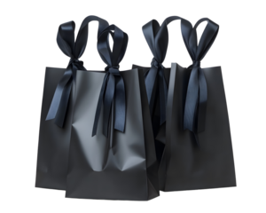 Elegant black gift bags with satin ribbons, perfect for celebrations and special occasions, conveying style and sophistication.