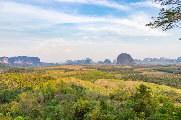 Obraz premium Panoramic view from the Din Daeng Doi viewpoint. Endless wide valley with hills covered with tropical forests, pointed cliffs.