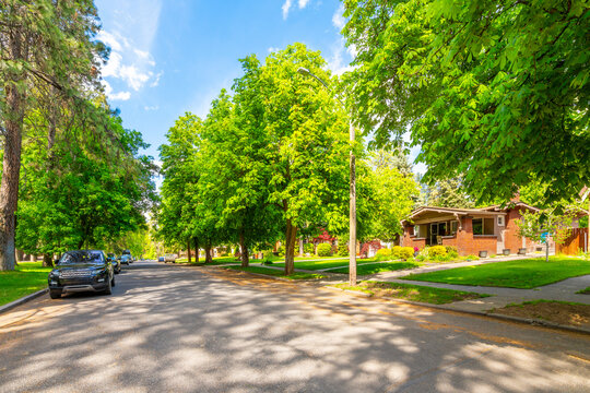 A tree lined street of historic homes at the Manito Park district, in the South Hill area of Spokane, Washington, USA.