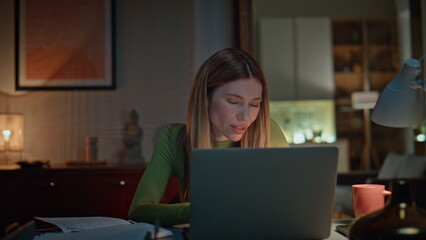 Businesswoman talking late videocall by laptop worried work problem close up.