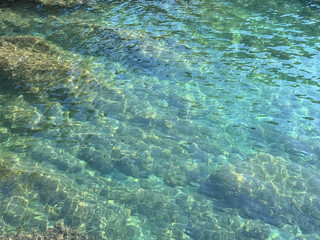 Mediterranean sea beautiful seascape clear water with stones and algae.