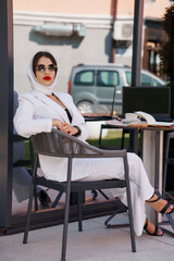 Stylish Business Woman in Modern Office Setting with Contemporary Attire