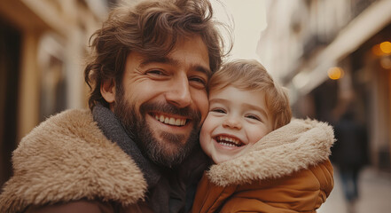 Obraz premium Father and son warmly smiling, bundled up in winter coats during a walk. Heartwarming moment between parent and child, capturing happiness, love, and family connection in a cozy setting
