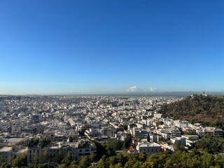 View from Athena Greece atop the Acropolis, city views from the top of famous ancient ruins. 