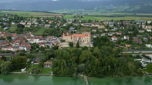 Crane drone shot of Grandson Castle next to Lake Neuchatel in Canton of Vaud in Switzerland.