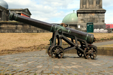 Old Cannon On The Edinburgh Castle Scotland Great Britain On A Beautiful Summer Day With A Few Clouds In The Sky