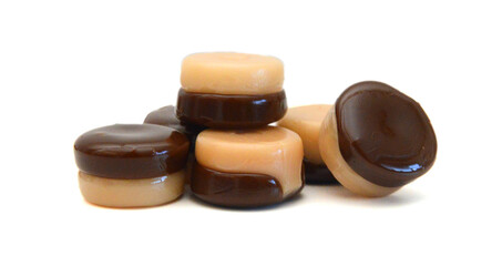 Caramel candies isolated on white background