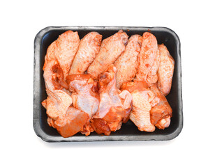 Raw chicken meat with bone on a white background