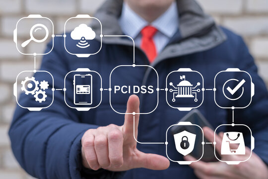 Business man working on virtual touch screen presses acronym: PCI DSS. Payment Card Industry Data Security Standard (PCI DSS) Concept. IT Security.