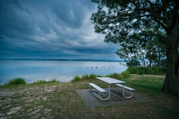 The photo shows a lakeside view located in Ken Lambkin Reserve