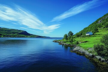 Fototapeta premium Serene fjord landscape with green hills and a small house