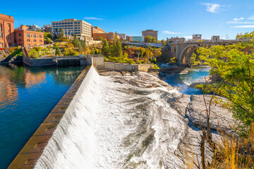 View from the riverside Centennial Trail looking over the Lower Spokane Falls with Riverfront Park,...