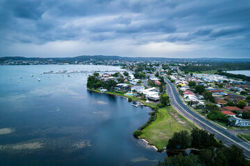 The photo shows a lakeside view located in Ken Lambkin Reserve