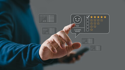 Person using a smartphone giving a five-star rating with an interactive digital interface on a gray background.