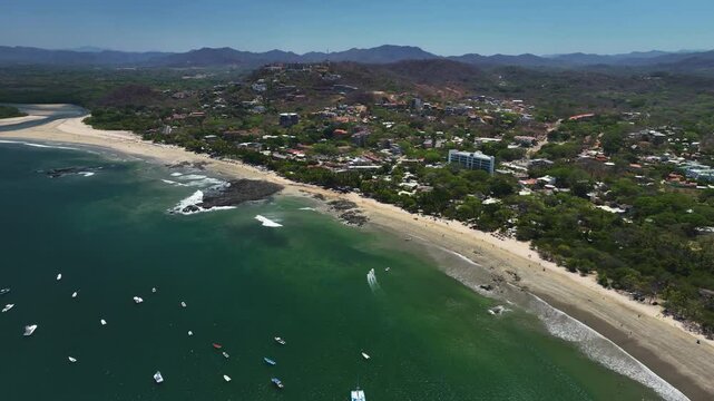 Panoramic drone shot of the Tamarindo beach, in sunny Guanacaste, Costa Rica