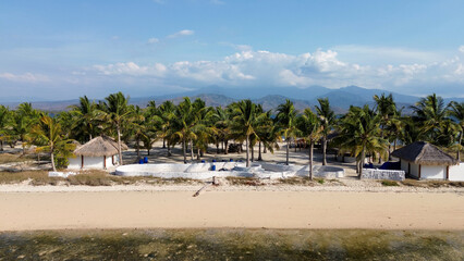 Small island Pulau Bedil, tropical island in Indonesia. Drone view.