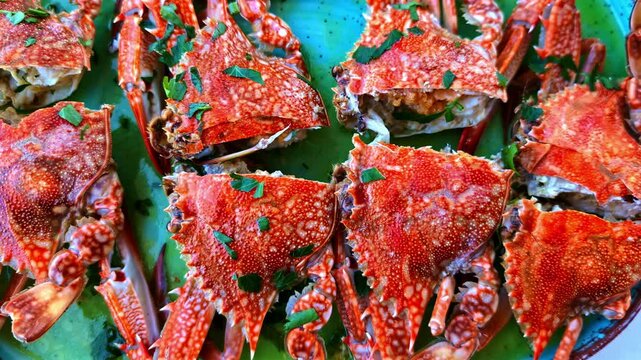 Cooked Crabs With Chopped Parsley Served At Seafood Restaurant. overhead, pullback shot
