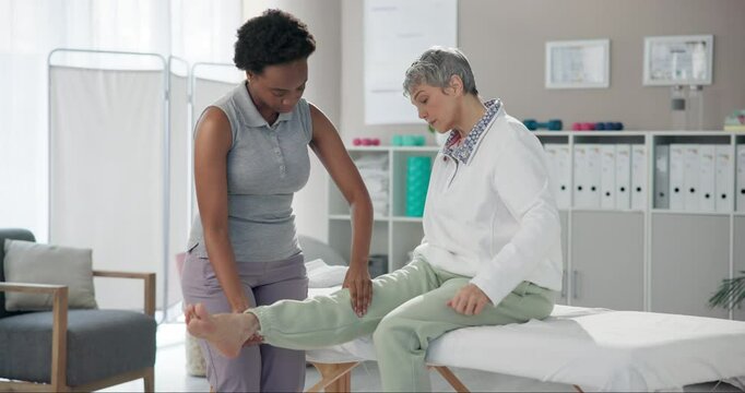 Physiotherapist, rehabilitation and knee of mature woman in clinic for wellness, arthritis and balance. Geriatric therapist, massage and stretching legs with osteoporosis, sciatica or gout for health