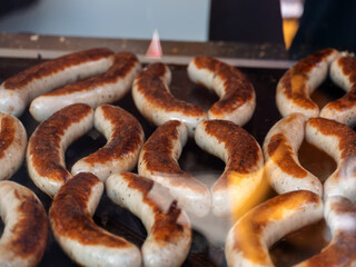 Grilled Sausages Cooking on a Hot Grill