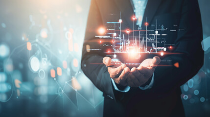 Businessman in suit holding digital screen with rising healthcare investment graph, symbolizing growth and financial success in medical sector.