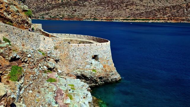 Panoramic landscape of Spinalonga fortress Greek Cliff blue marine sea bay old historic travel destination