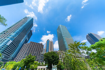 looking up view of city skyline in tokyo, japan