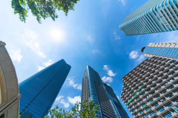 looking up view of city skyline in tokyo, japan