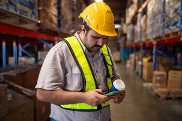 Portrait of male staff with holding clipboard working in warehouse, Industrial and industrial workers concept.