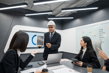 Business team meeting discuss of renewable energy working on an innovative more efficient solar cell panel battery. Solar generator power Generating electricity clean energy