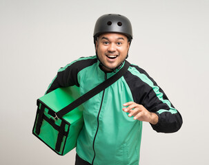 Young asian rider wearing green jacket uniform and bike helmet various action with delivery box....
