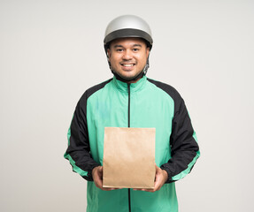 Young asian rider wearing green jacket uniform and helmet various action holding food paper bag delivery to customer. Male delivery service worker. Courier and shipping food service.