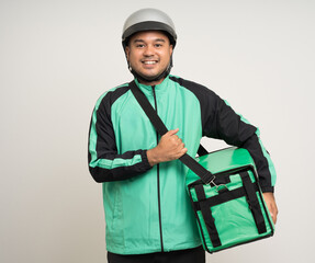 Young asian rider wearing green jacket uniform and helmet various action holding a lot of paper parcel delivery box to customer. Man service worker Courier and shipping food delivery service.