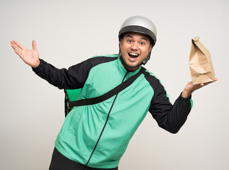 Young asian rider wearing green jacket uniform and helmet various action holding a lot of paper...