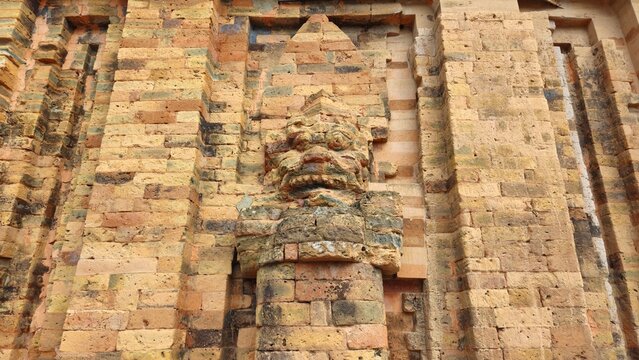 Close up of statue on the brick wall of Po Nagar temple complex at Nha Trang city, Vietnam.
