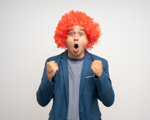 Shocked face Young Asian man with afro Hairstyle. Funny smiling happiness man with suit jacket on isolated white background.