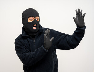 Thief in uniform black jacket various pose on isolated background. The Robber terrorism criminal escapes with balaclava and crowbar entering a house for stealing Housebreak