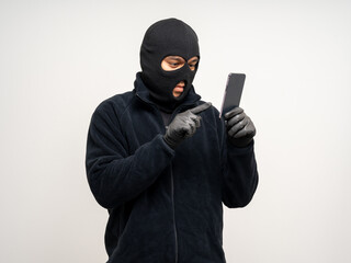 Thief in uniform black jacket various pose on isolated background. The Robber terrorism criminal...