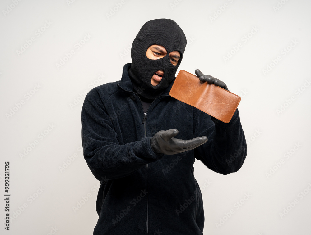 Wall mural Thief in uniform black jacket various pose on isolated background. The Robber terrorism criminal escapes with balaclava and crowbar entering a house for stealing Housebreak