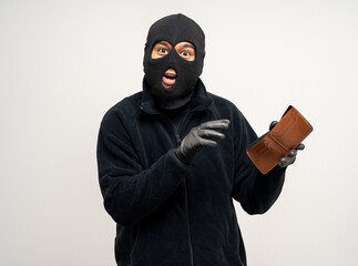 Thief in uniform black jacket various pose on isolated background. The Robber terrorism criminal escapes with balaclava and crowbar entering a house for stealing Housebreak