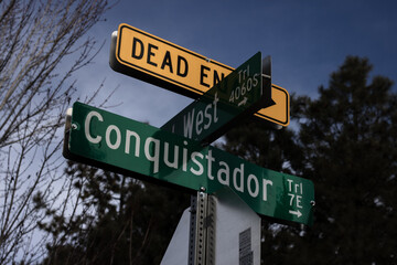 Street signs with a dead end sign