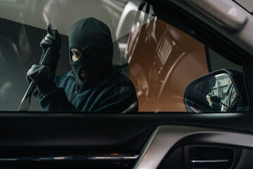 Thief in uniform black jacket various action stolen cars. The Robber terrorism criminal car with...