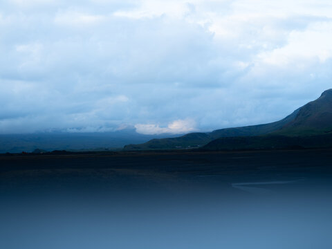 clouds over landscape in iceland