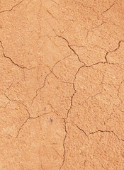 Cracked ground background in the top view for graphic design or wallpaper