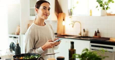 Woman, cooking and thinking with phone in kitchen for healthy online recipe, meal ideas and salad...