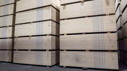 A stack of wood planks with a white stripe on them