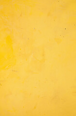 Bright Yellow Textured Surface with Subtle Marks and Scratches