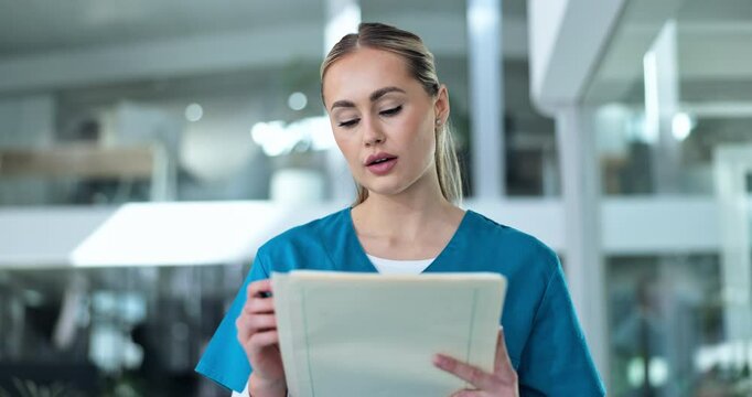 Walking, nurse or woman in hospital with chart, inspection and notes for healthcare management. Writing, admin and medical professional in lobby with folder, checklist or schedule planning for clinic