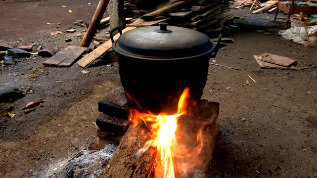 cooking water with a traditional stove or stove or pawon, using firewood